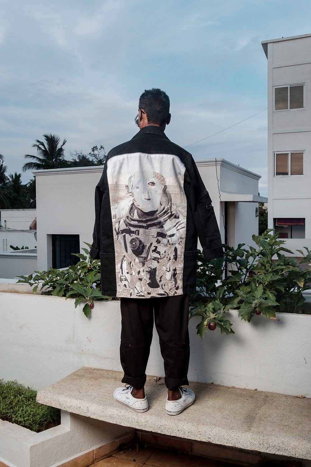 Black Unisex Denim Jacket with multiple functional pockets and art print panel on the back.  Designed in Madras, Made in India  | BISKIT UNISEX CLOTHING LABEL